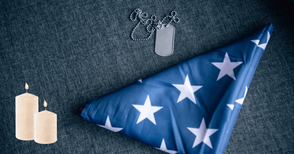 textured background with folded american flag and candles signifying remembrance